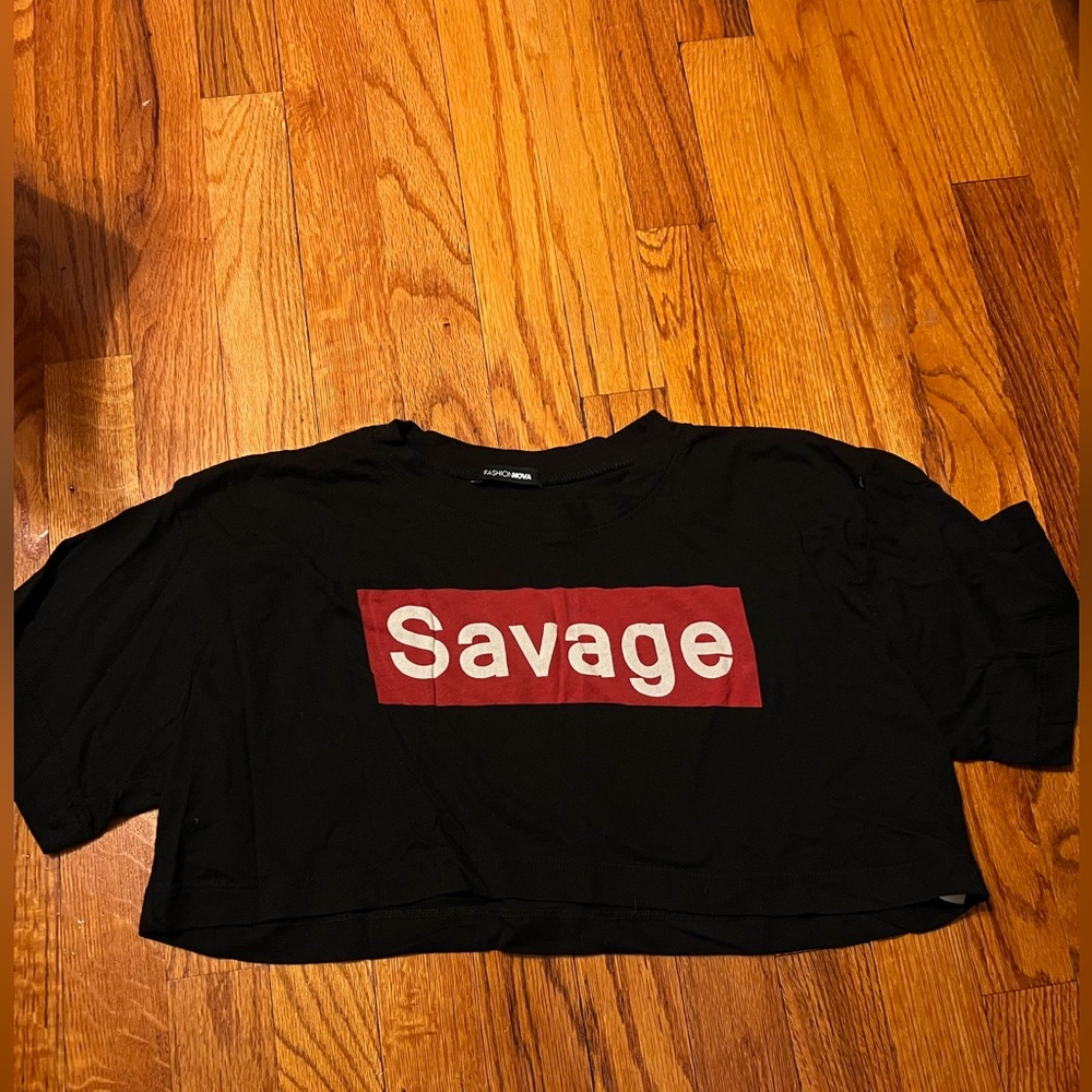 Cropped T-shirt that says “savage” on it